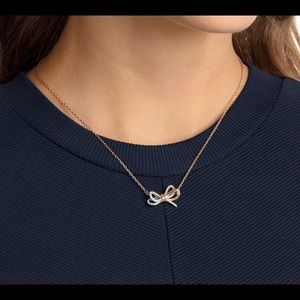 Swarovski lifelong bow pendant.